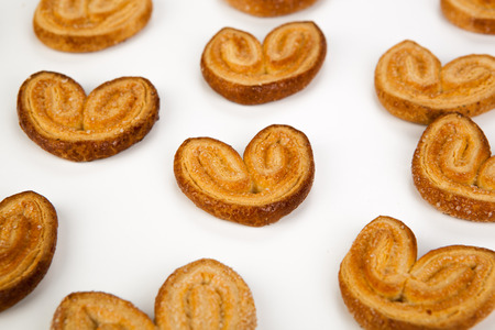 cookies of puff pastry in the shape of hearts close-upの写真素材