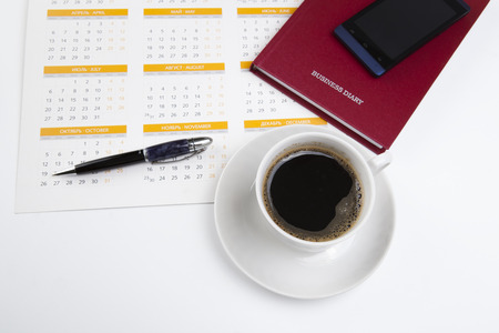 business still life consisting of sheet of a calendar, telephone, diary, penの写真素材