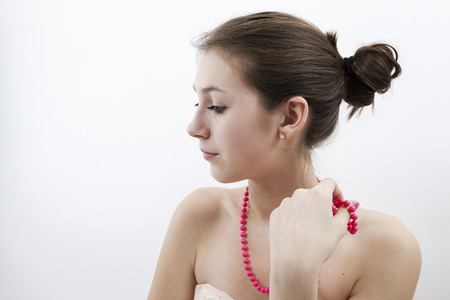 portrait of a girl with pink beadsの写真素材