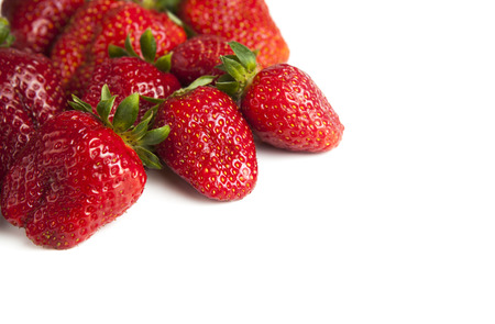 handful of strawberries on a white backgroundの写真素材