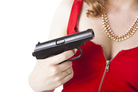 lady in red holding a pistol on a white backgroundの写真素材