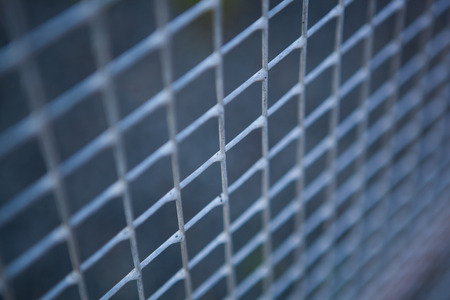 small metal grille from the fence closeupの写真素材