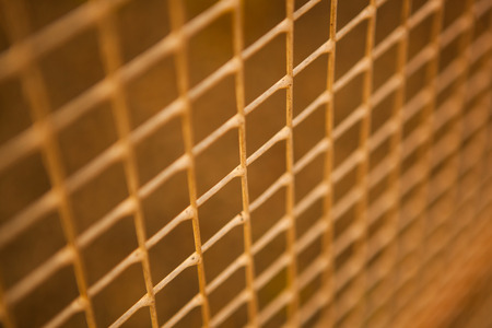 small metal grille from the fence closeupの写真素材