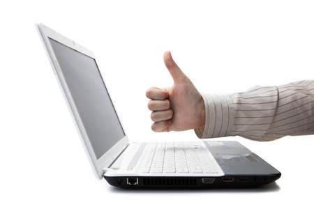 man's hand on a laptop on a whiteの写真素材