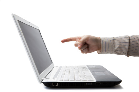 man's hand holding a finger on a laptop on a whiteの写真素材