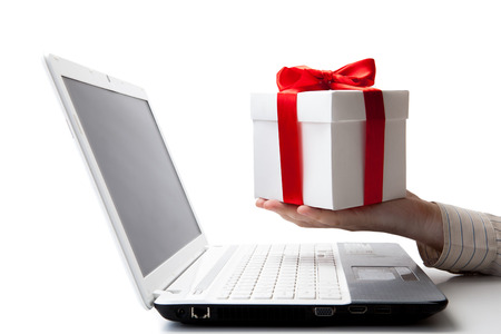 giving a gift online on a laptop on a whiteの写真素材