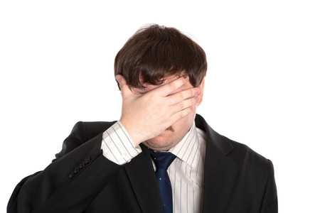 businessman in stress on a white backgroundの写真素材