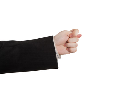 man's hand indicates greed on a whiteの写真素材