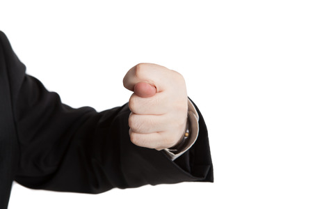 man's hand indicates greed on a whiteの写真素材