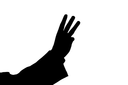 man's hand showing three black on a whiteの写真素材