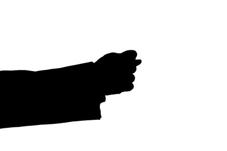 man's hand indicates greed black on a whiteの写真素材