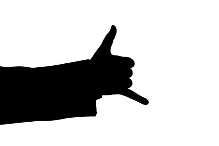 man's hand indicates calling black on a whiteの写真素材