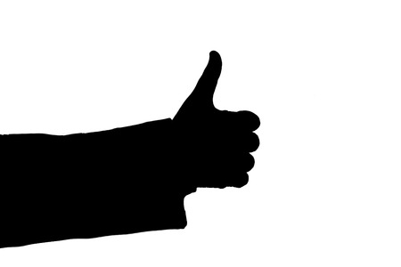 man's hand showing sign cool black on a whiteの写真素材