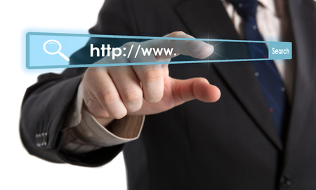 man's hand clicks on the address bar closeupの写真素材