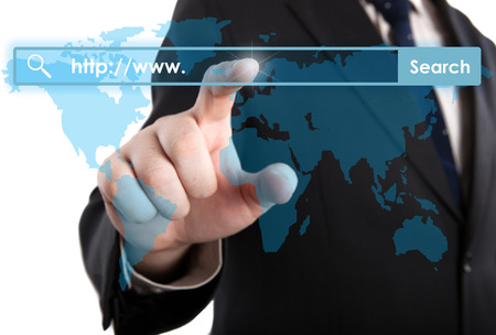 man's hand clicks on the address bar closeupの写真素材