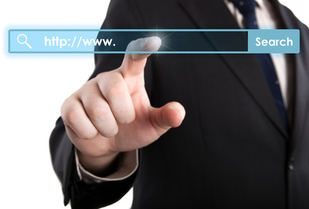 man's hand clicks on the address bar closeupの写真素材