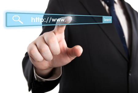 man's hand clicks on the address bar closeupの写真素材