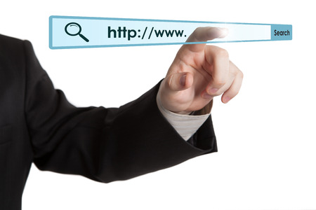 man's hand clicks on the address bar closeupの写真素材