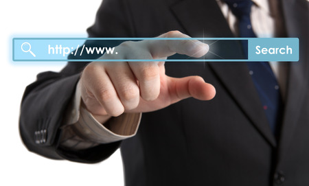 man's hand clicks on the address bar closeupの写真素材