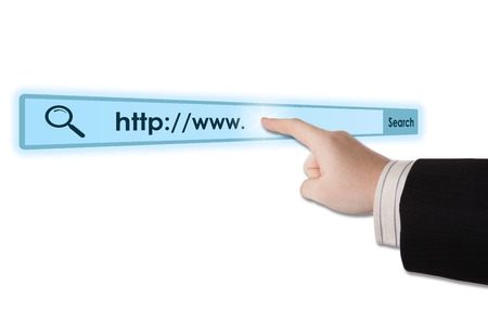 man's hand clicks on the address bar closeupの写真素材