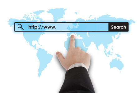 man's hand clicks on the address bar closeupの写真素材