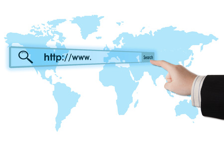 man's hand clicks on the address bar closeupの写真素材