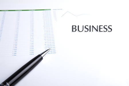 business still-life with pen on a white closeupの写真素材