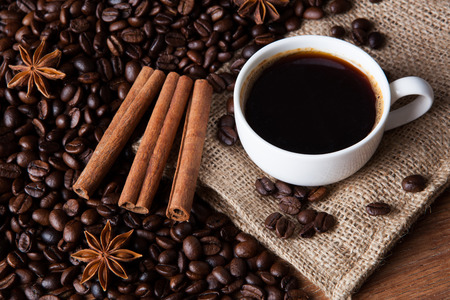 cup of black coffee and cinnamon sticks closeupの写真素材