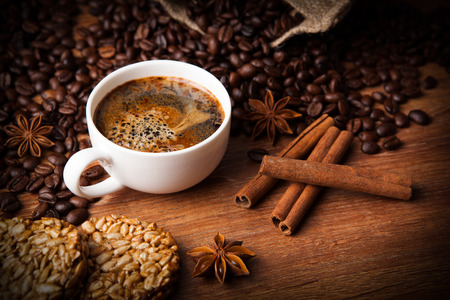 roasted coffee and cinnamon sticks closeupの写真素材