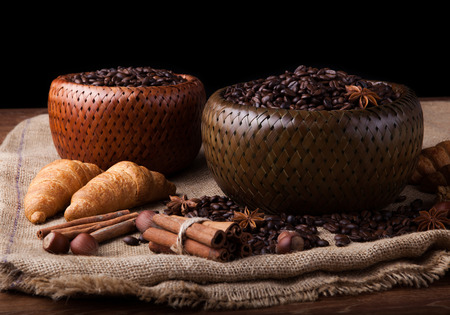 roasted coffee beans in a bamboo basket still lifeの写真素材