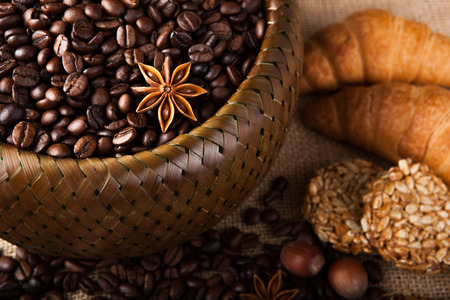 roasted coffee beans in a bamboo basket still lifeの写真素材