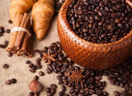 roasted coffee beans in a bamboo basket still lifeの写真素材