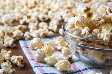 lot of salt popcorn into a bowl close upの写真素材