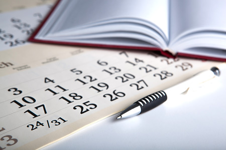 calendar days with numbers and pen close upの写真素材