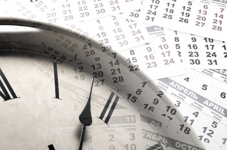 sheet of a calendar with the number of days and clockの写真素材