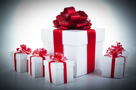 one white gift box and white gift boxes on grayの写真素材