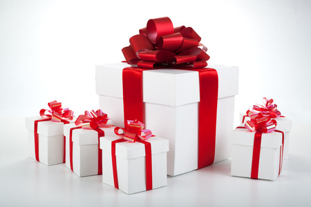 one large white gift box and white gift boxes on grayの写真素材
