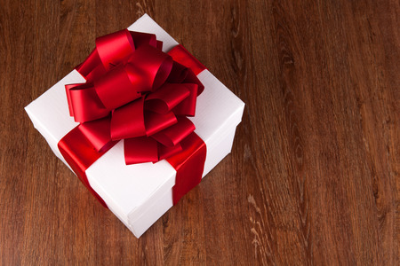 one large white gift box top view on a wood backgroundの写真素材