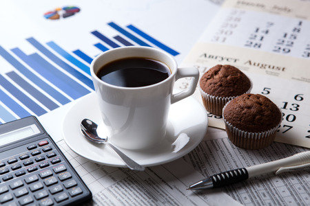 business still life and cup of coffee with newspapersの写真素材