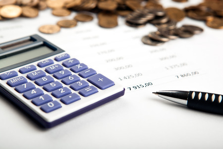 work on the calculator and papers close upの写真素材