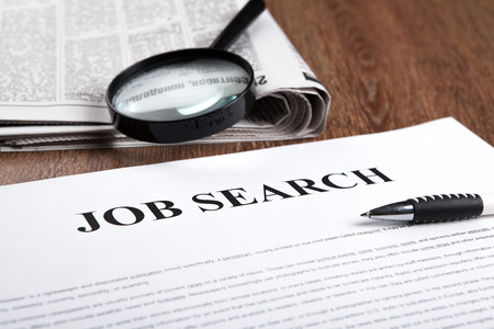 document with the title of job search with newspaper closeupの写真素材
