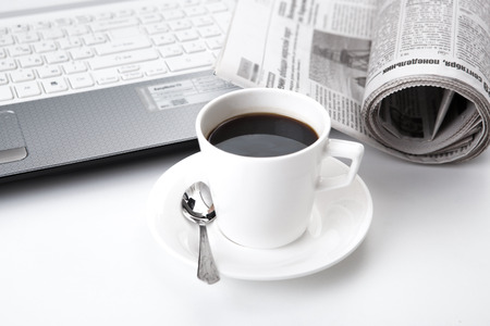 business still life and cup of coffee and newspaperの写真素材