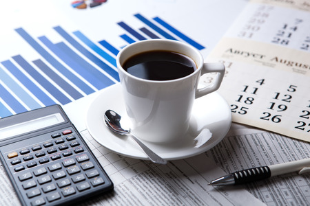 business still life and cup of coffee with newspapersの写真素材