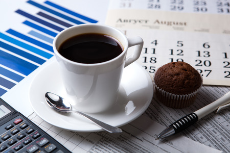 business still life and cup of coffee with newspapersの写真素材