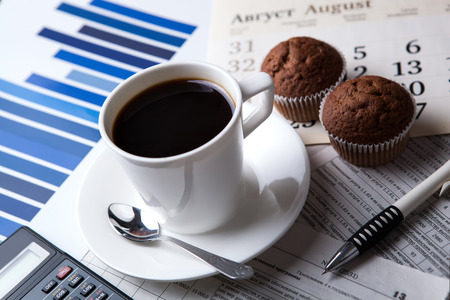 business still life and cup of coffee with newspapersの写真素材