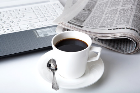 business still life and cup of coffee and newspaperの写真素材