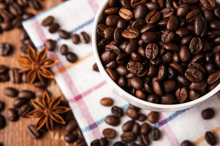 Still-life with a cup of coffee beans close upの写真素材