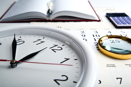 business stil life with clockface close upの写真素材