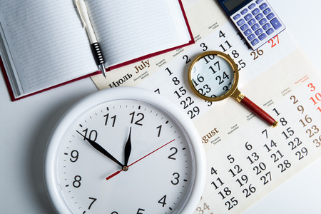 business stil life with clockface close upの写真素材