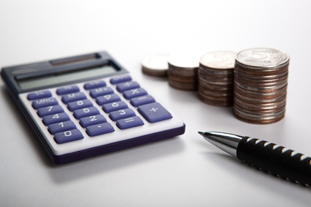 handful of Russian rubles with calculator close upの写真素材